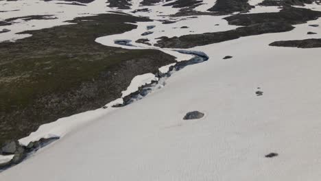 drone video of the melting snow in the mountains