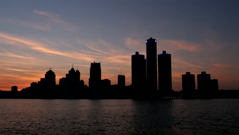 silhouetted detroit skyline at sunset