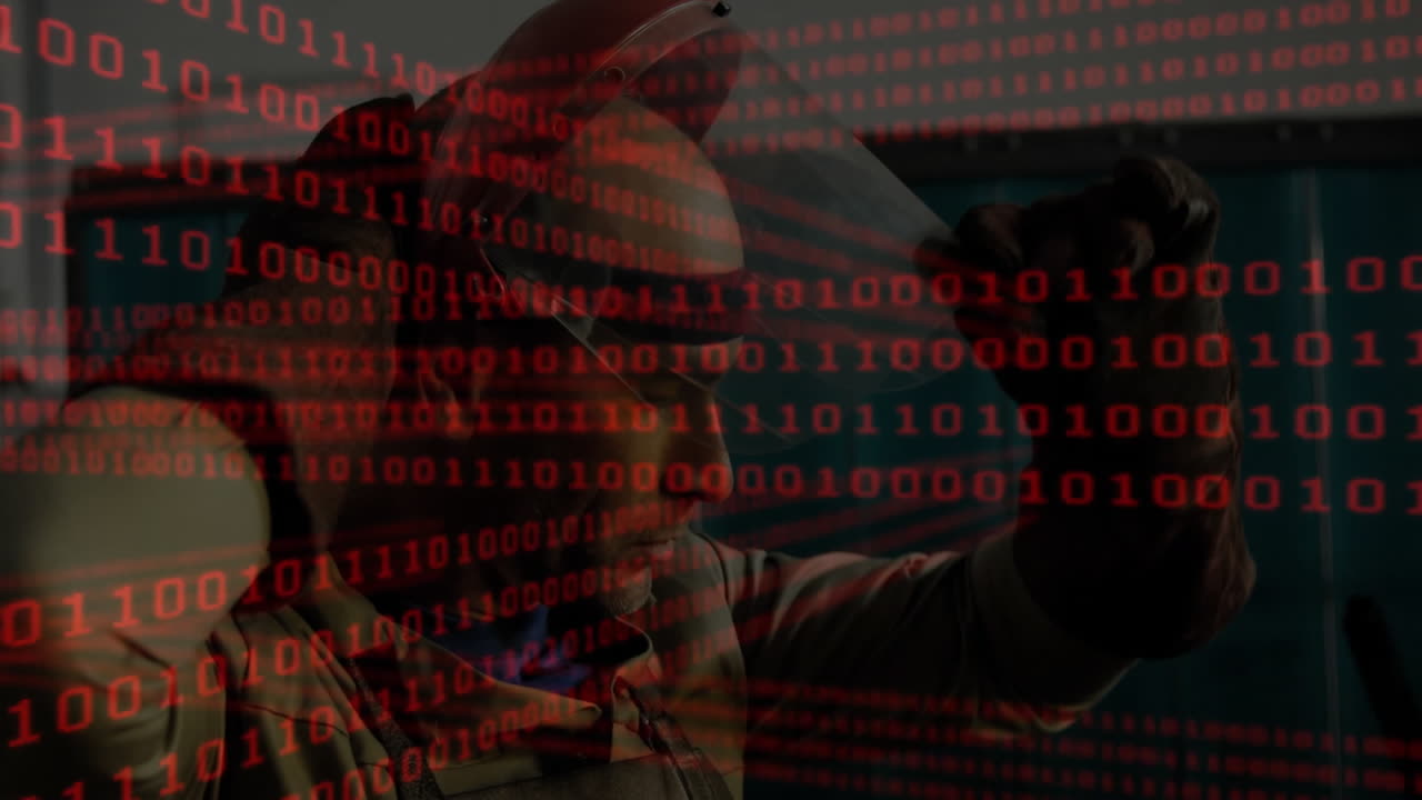 male welder operating torch, projecting red binary code overlay across industrial workshop