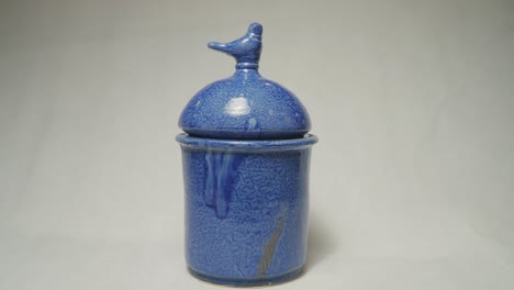 blue handmade clay tableware on a white background