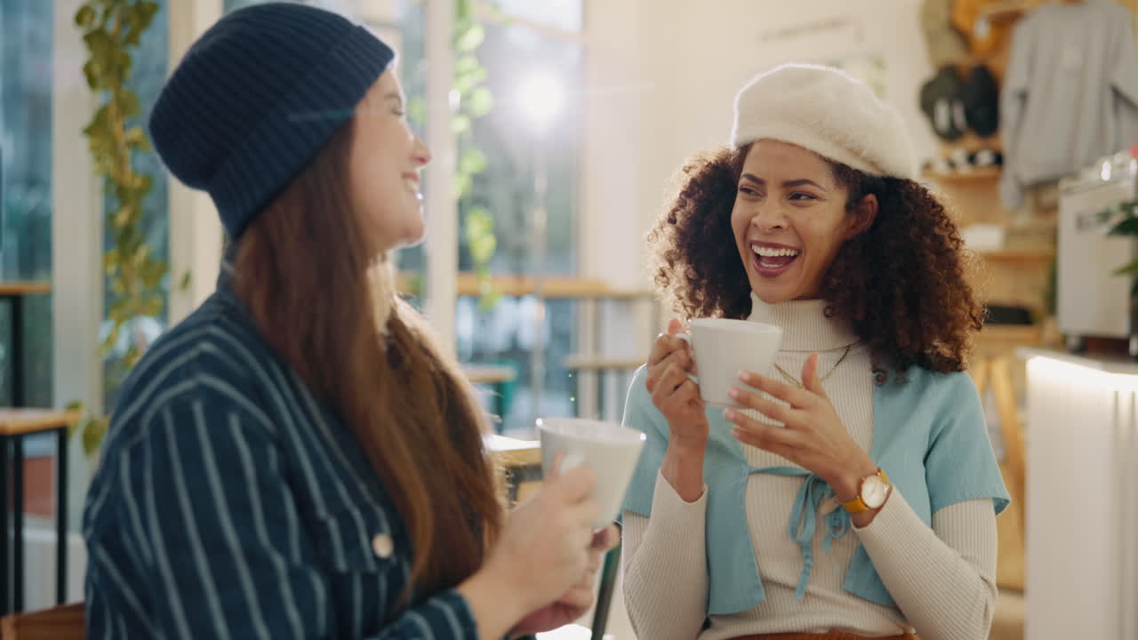 Two friends enjoying coffee and conversation in a cafe