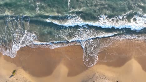 Pull-Out-shot-of-waves-coming-to-shore