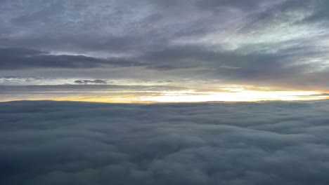 aerial view while flying through a cold winter sky at dawn