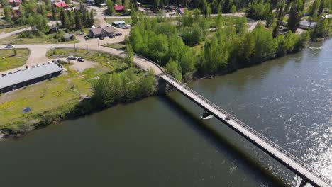 drone footage of deforestation in the canadian forest. river running next to the mountains in a village of indiginous tribes
