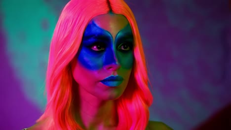 woman with neon makeup and pink hair