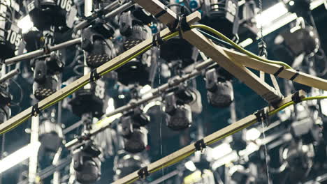 a special effects rain machine in a film cinema studio with a ceiling full of film lights