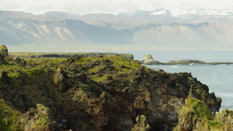 coastline and mountains in snaefellsnes peninsula, iceland, wide shot tilt up