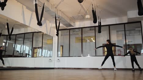 woman and child exercising and moving in a fitness studio