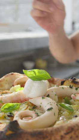 raw basil topping for a gourmet pizza with octopus