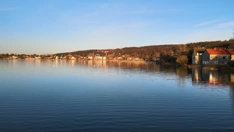 drone flight over lake ammersee near munich at sunset