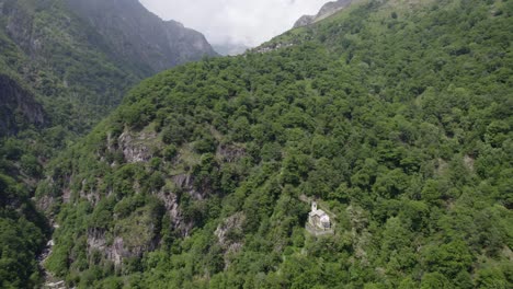 remote church on forest covered mountain livo valley province of como