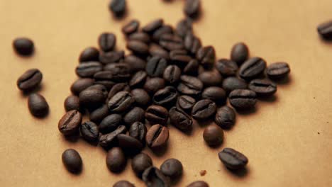 Coffee-beans-on-old-paper-rotating-4K-video