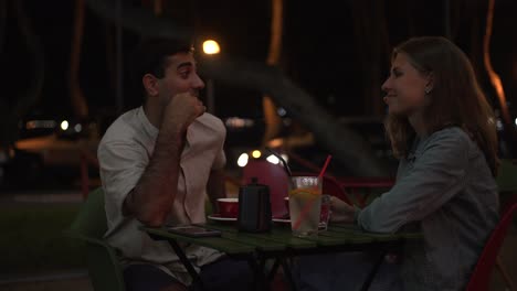 couple enjoying a night out at a cafe