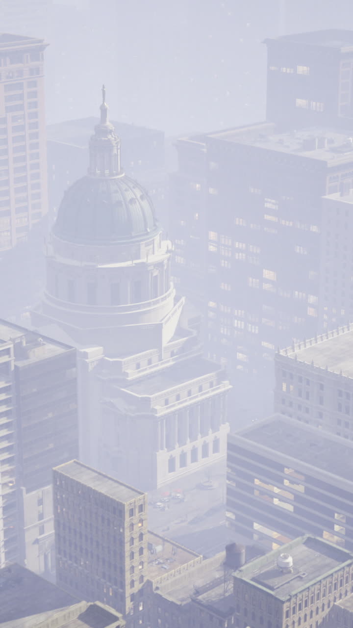 City skyline shrouded in fog with historic building in center