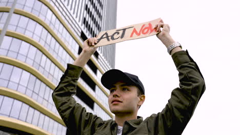 close up of a man holding a placard 3