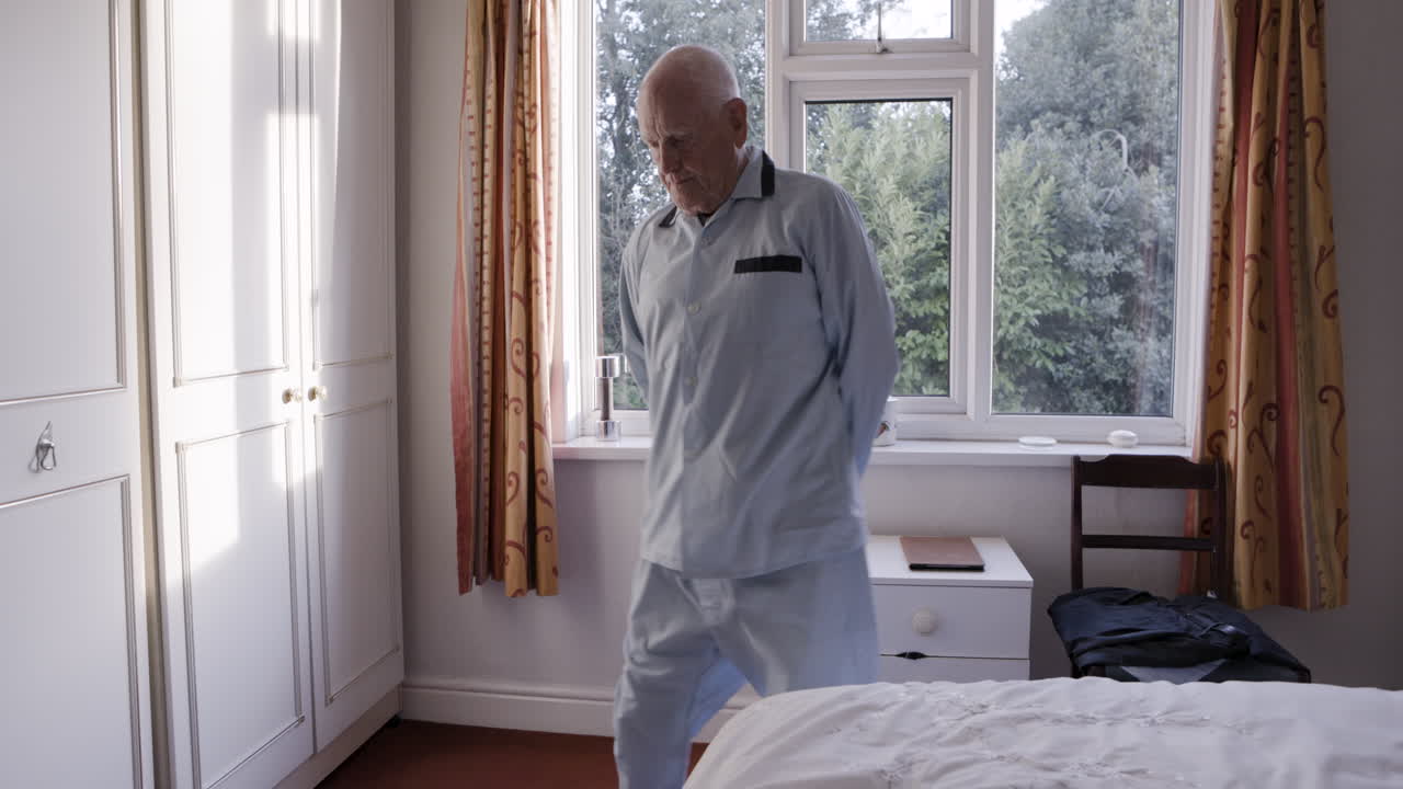 An elderly man in his bedroom