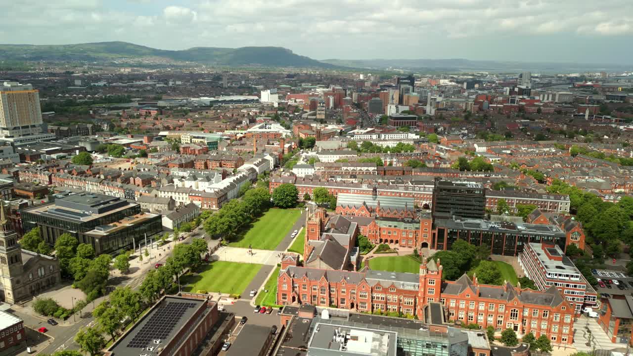 Ultra-wide reversing aerial video of Queen's University Belfast, in Northern Ireland, UK on a bright and sunny day. Produced at 4K resolution, 60FPS and with Rec709 color.