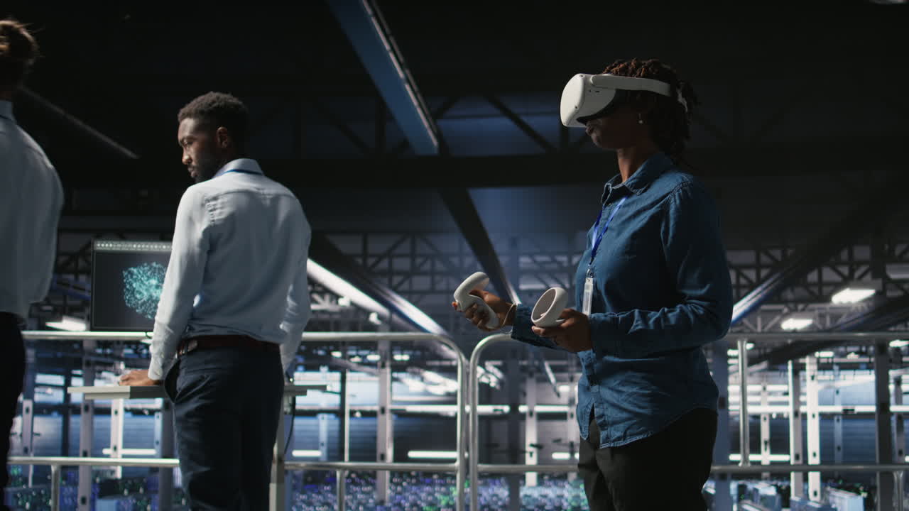 Engineer in data center analyzing performance outputs using virtual reality