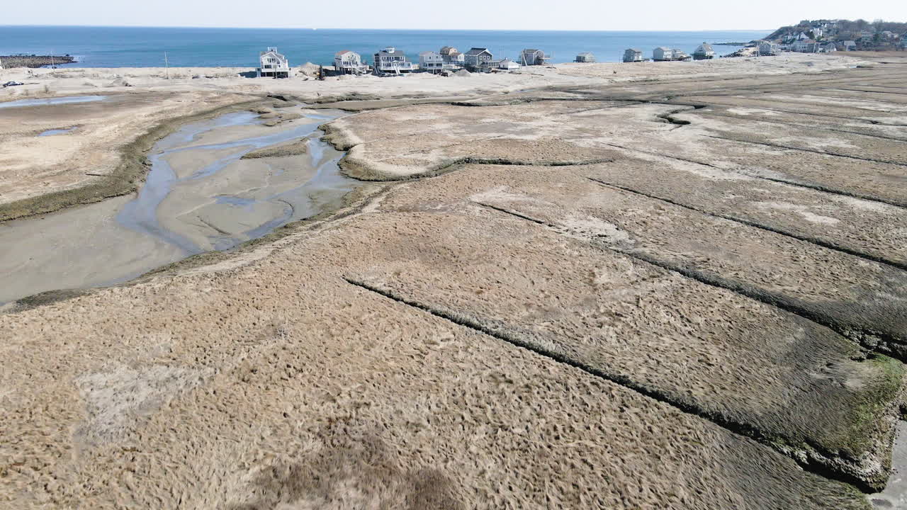 Aerial View of Coastal Houses and Salt Marsh