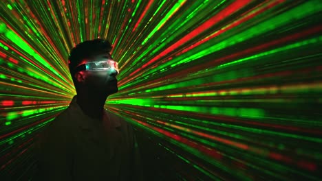 the man in the interactive glasses on the laser beam background