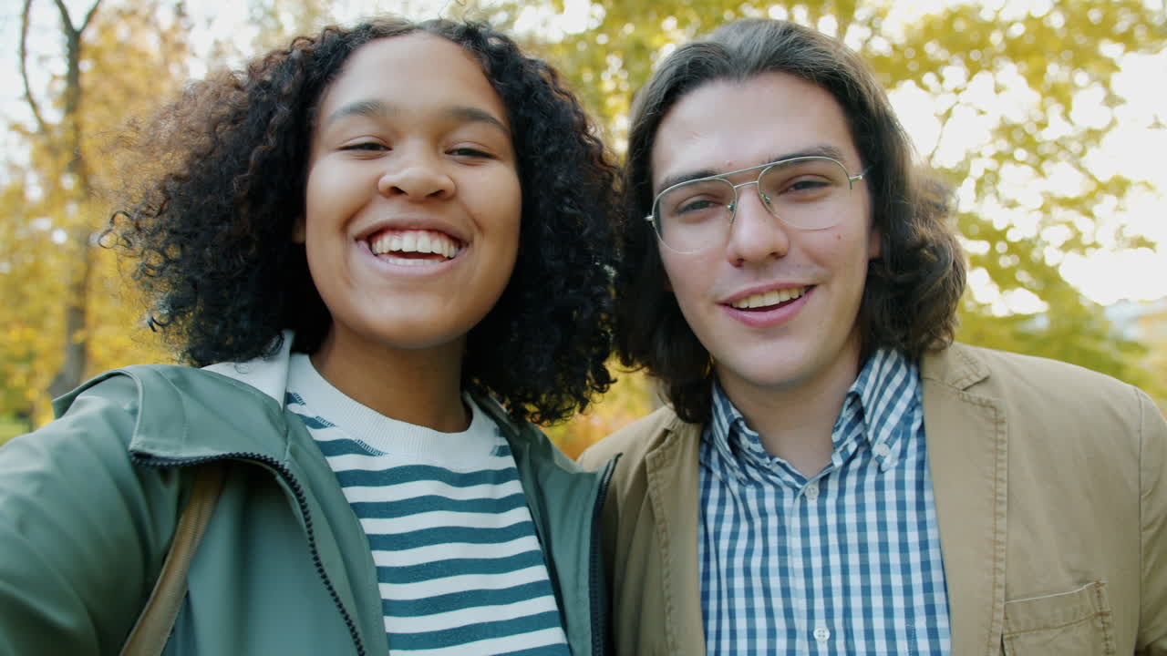 Happy Couple Taking a Selfie in Autumn Park