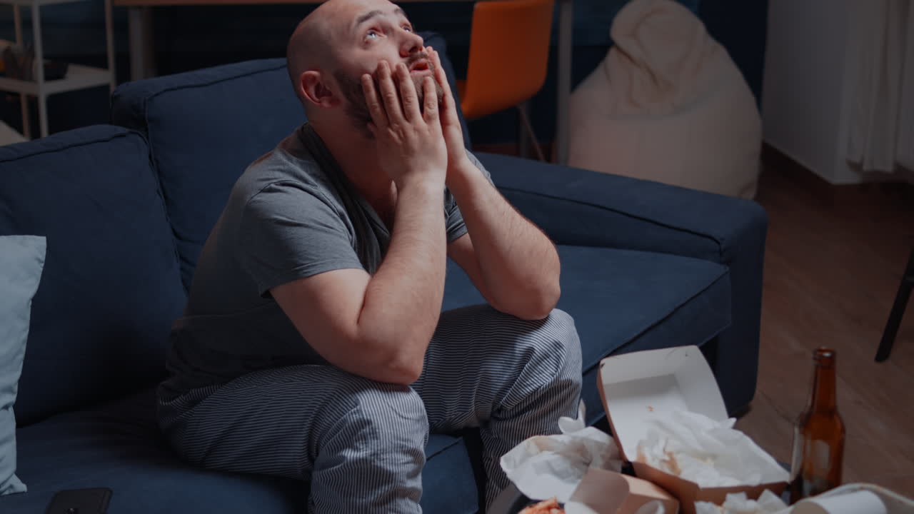 Frustrated overdue young man receiving bad news