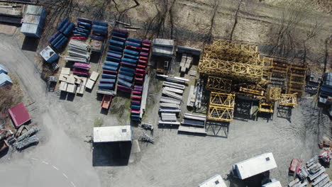 building crane spare parts at storage, construction scene, aerial top down