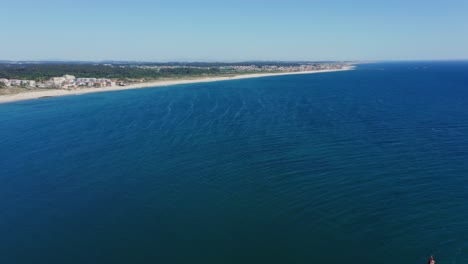 Panoramic-aerial-of-the-coastal-shore-of-Azurara-Beach-in-Vila-do-Conde,-Portugal