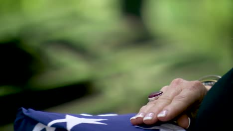 veteran flag coin hand off during funeral