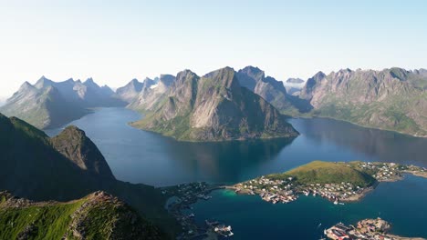 on a sunny day, an aerial view shows one of the best scenes one can see on a hike in reinebringen, located in the lofoten islands of norway