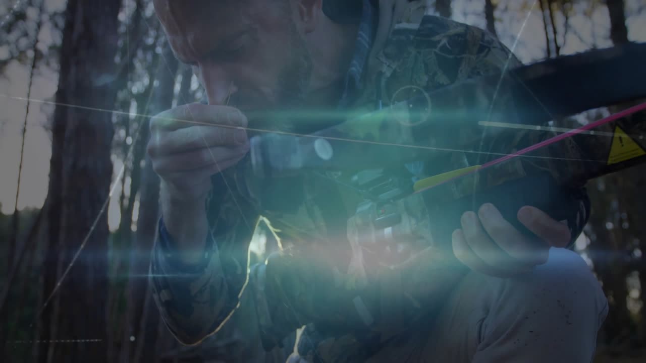 Man spotting yellow-fletched bolt among pine needles and loading compound crossbow for hunting