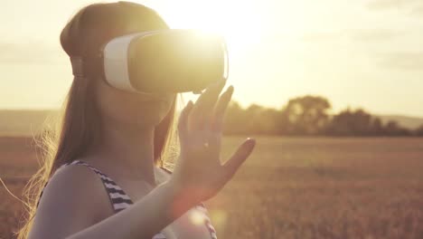 woman experiencing virtual reality headset at sunset