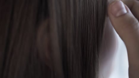 close-up of a woman's ear with earrings