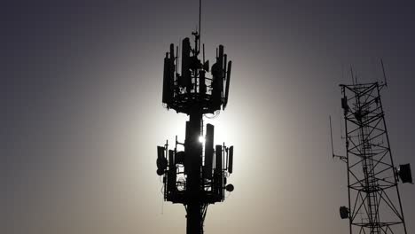 silhouette of communication towers