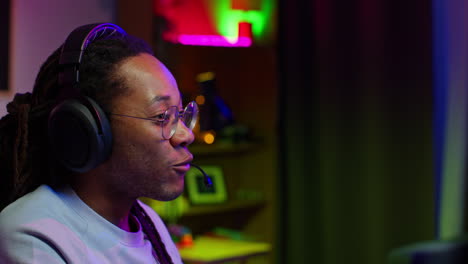 young man gaming with headset and microphone