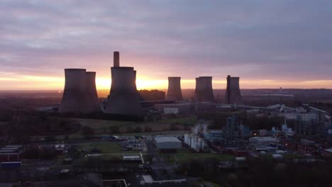 fiddlers ferry disused coal fired power station during golden hour, aerial view rising across warrington landmark