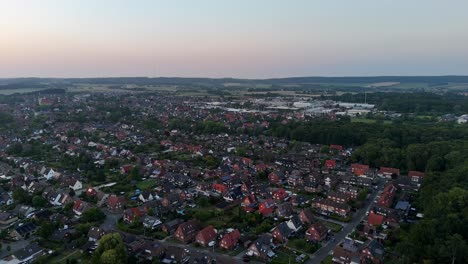 America city on Wisconsin, Pennsylvania or Minnesota at sunrise. Aerial lateral wide shot. Red brick houses and roofs with orange tile. Dawn scene in USA. Summer season