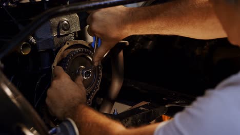 male mechanic servicing a car 4k