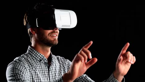 Smiling-man-using-virtual-reality-headset-4k