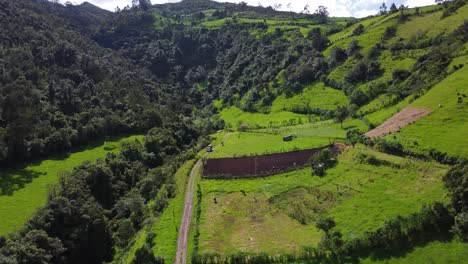 Aerial-Drone-Pull-Over-Foothills-of-the-Pasochoa-volcano,-Puichig,-Machachi-valley,-Cantón-Mejía,-Pichincha-Province,-Ecuador