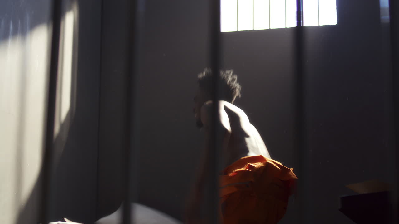 Inmate Throwing Papers and Pillow in Emotional Outburst in Prison Cell