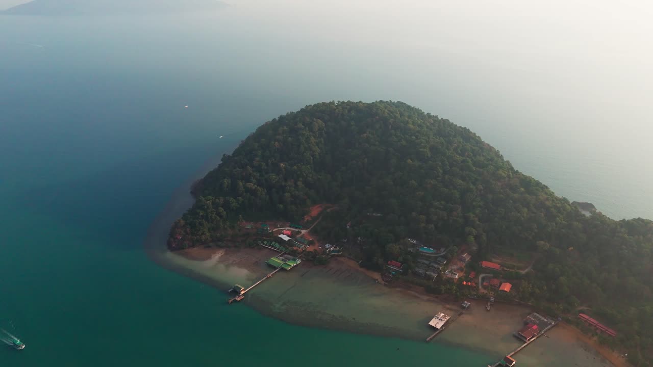 Drone fly at peninsular forested island of Koh Chang Thailand, blue sea lagoon landscape