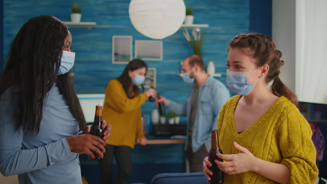 Diverse friends spending time together in apartment living room