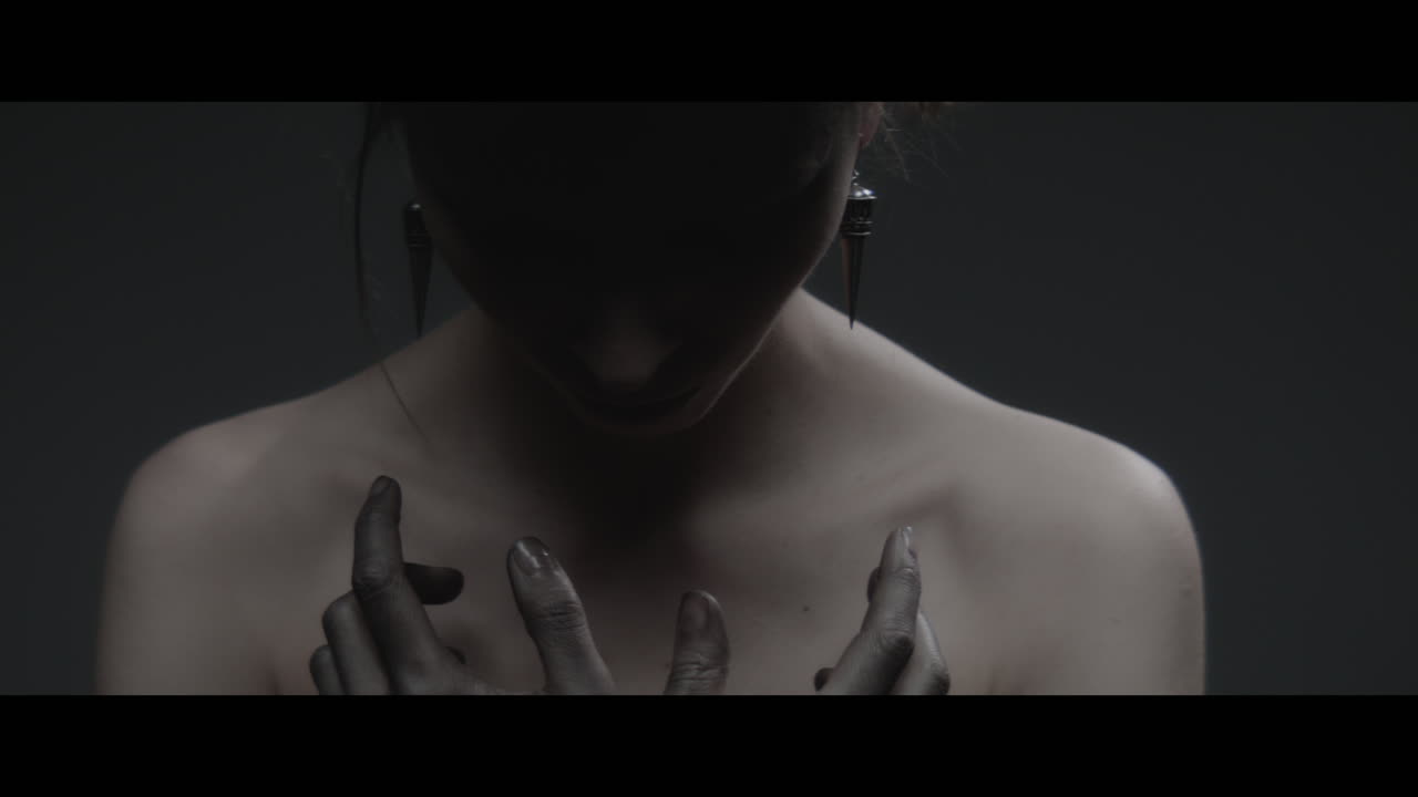 A woman dressed as mother nature rise her head