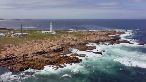 south africa lighthouse cape st francis summer garden route jbay aerial drone cinematic drive from still bay george stunning beautiful late afternoon sunny rugged coast waves seagull birds circling