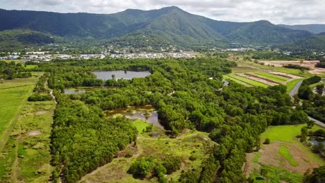 Sideways-aerial-footage-of-Cattana-Wetlands-and-Smithfield,-near-Cairns,-Queensland,-Australia