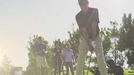 animation of light trails over senior caucasian couple playing golf on golf course