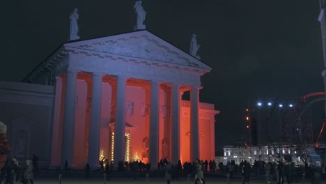 huge cathedral illuminated with red lights at night