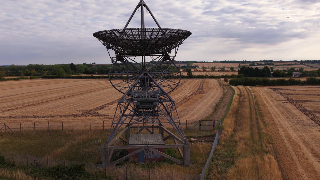 One-Mile Telescope With Rural Farmland In The Background At Mullard Radio Astronomy Observatory In Cambridge, England, UK. - aerial dolly shot