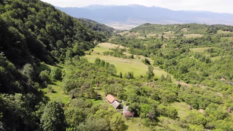 small village in a valley surrounded by forest and great views